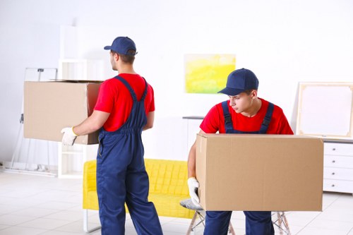 Removal team preparing household items for a move
