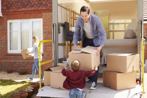 Local movers loading a van for a flat relocation in Harrow