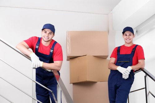 Organised office move with files, furniture, and IT equipment prepared for transport