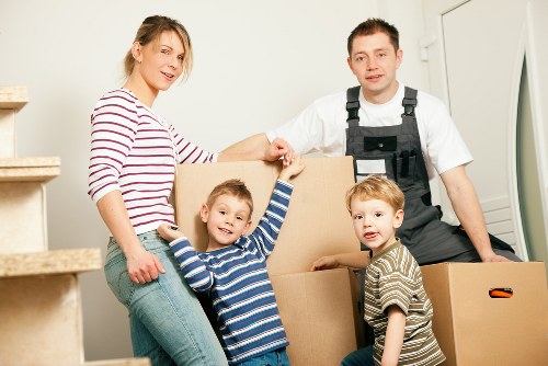 Packed boxes and furniture ready for storage near Harrow
