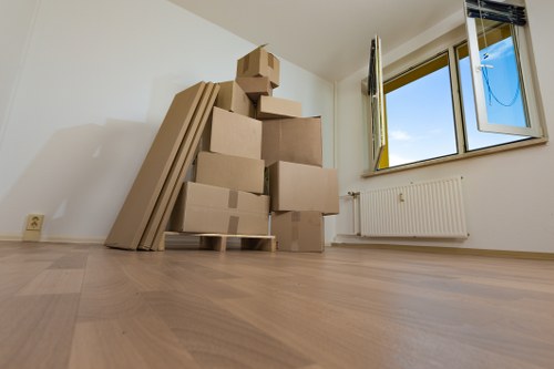 Furniture being carried safely through a flat stairwell