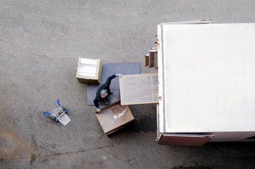 Removal team loading household items in Harrow