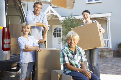 Local movers preparing fragile items for transport in Harrow