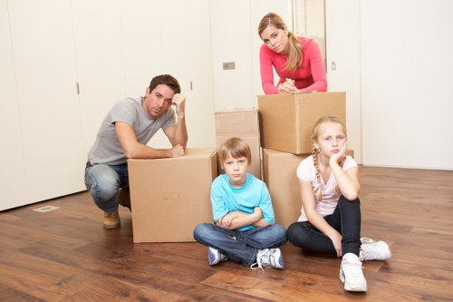 Household items and boxes organized for a move in Harrow