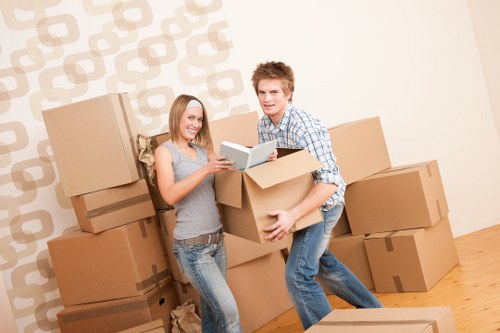 Loading furniture into a moving truck in Harrow
